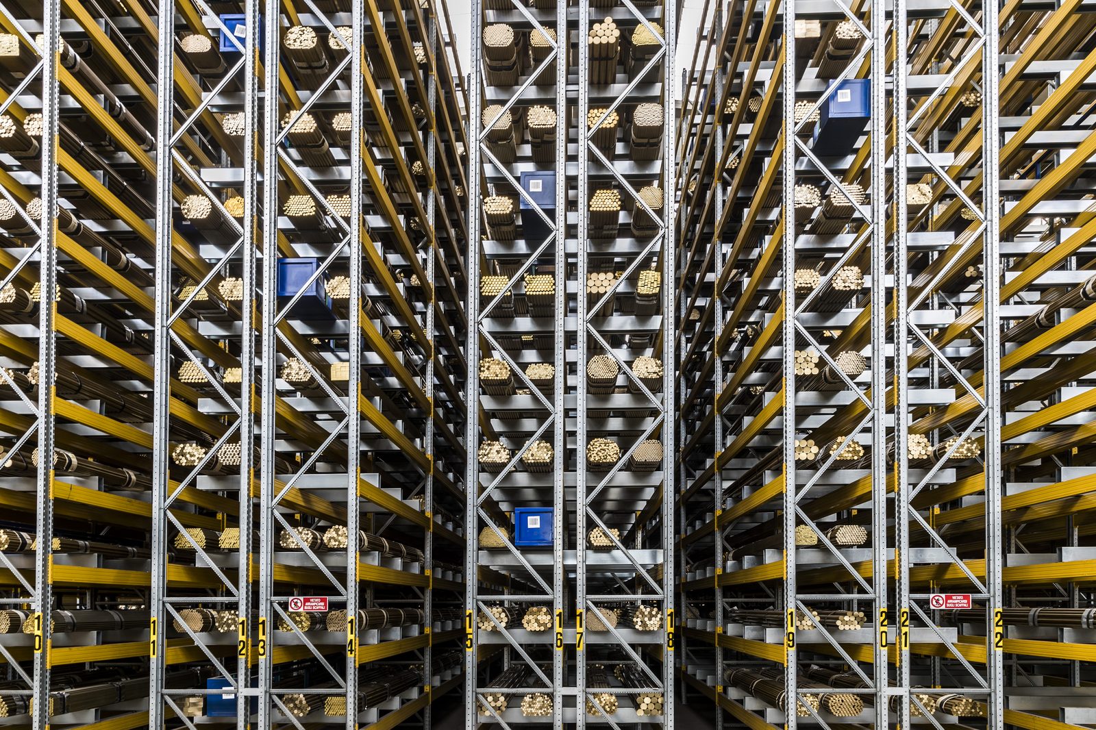 Racked brass bar stock at one of AES Metals' mill partners